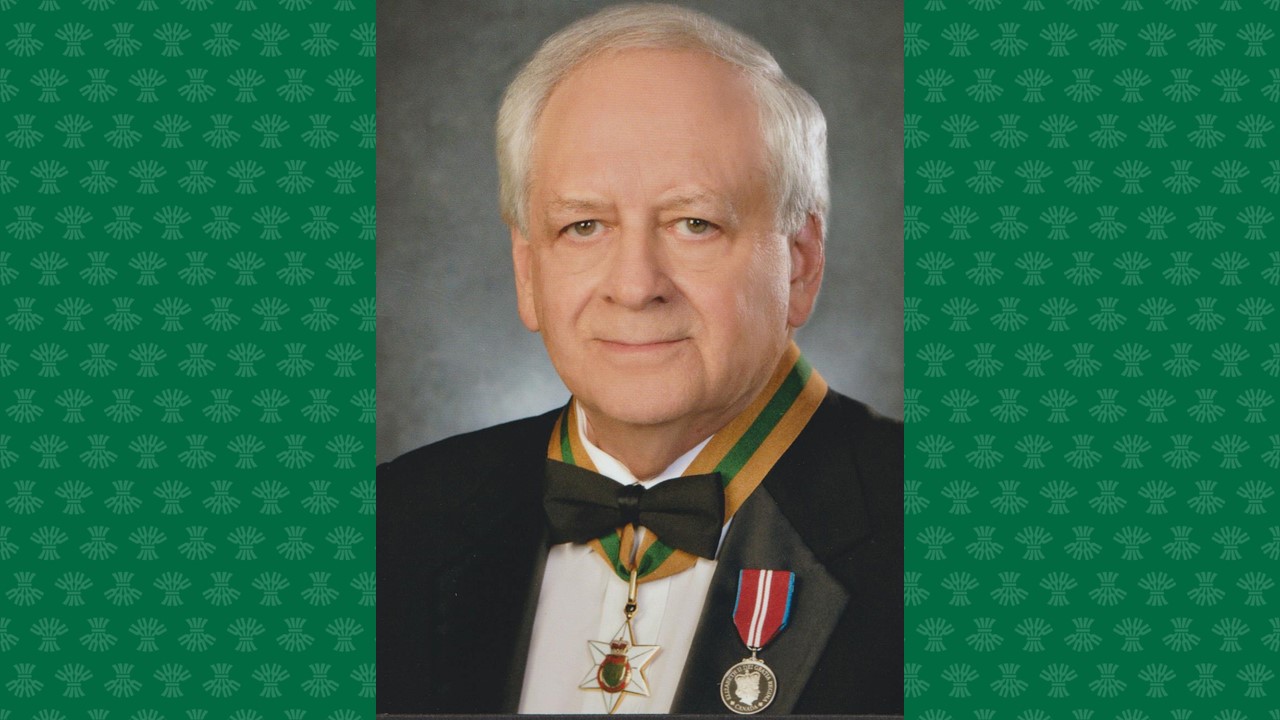 Headshot of Dr. Alan Rosenberg wearing his Saskatchewan Order of Merit medal