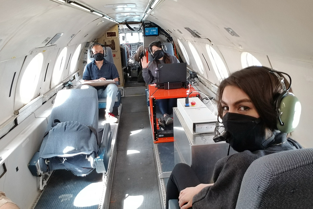 Dr. Gordon Sarty (PhD), left, and graduate students Pallavir Bohidar (at the computer) and Farnaz Zohourparvaz (front right), with the MRI located them, prior to takeoff on a recent test flight. (Photo: Duff Gowanlock)